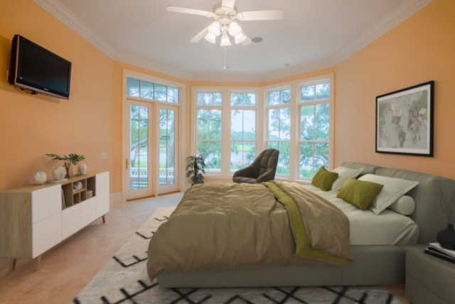 Master suite with water views and access to hot tub on back deck.