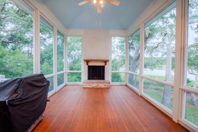 Screened-in porch with gas fireplace.