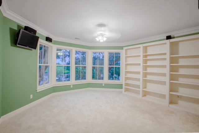 Office with built-ins and surround sound.