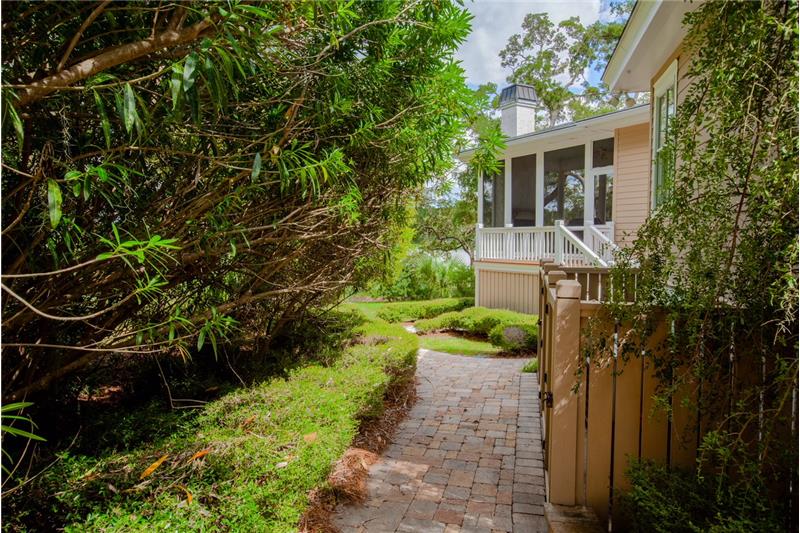 Side yard leading to doggie wash.
