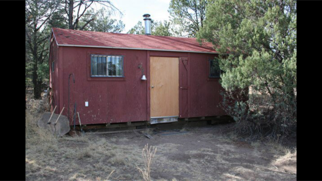 This is the Bunk house located next to the main home with wood heat and electric that can sleep 6 or be used for a man cave or c
