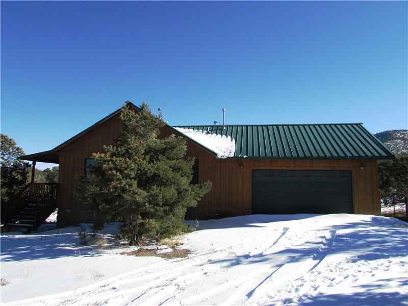 2 Car Heated Garage with Doggie Door Property is tucked away from the road for privacy.
