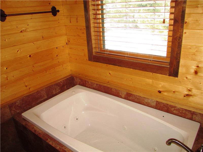 Owners suite jetted tub.