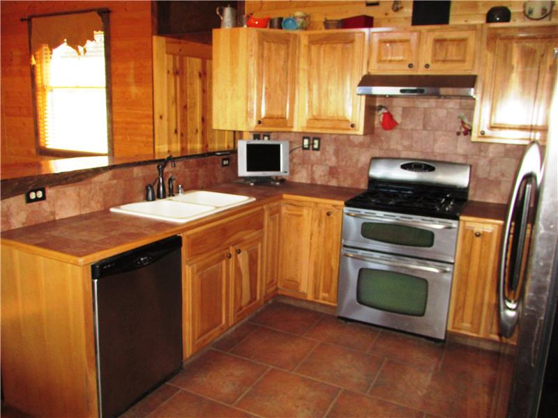 All Appliances stay. Cabinets have Lazy Susans in the corners to take advantage of the space and you have a nice sized pantry al