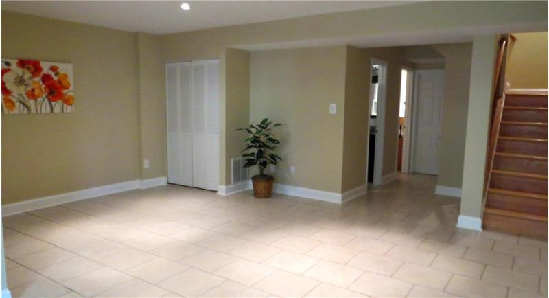 Large Recreation Area in Basement with Ceramic Tile Floor