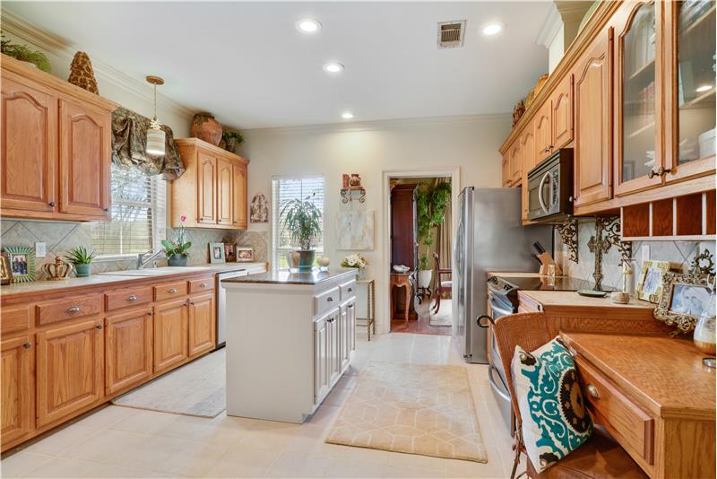 Large kitchen with updated canned lighting and appliances