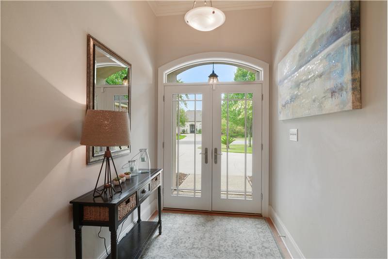 Foyer features double entry doors and natural light