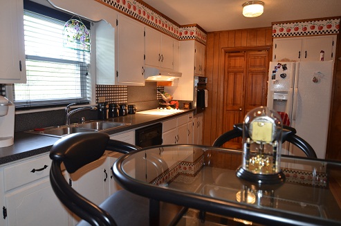 Large kitchen with room to cook and eat meals with family or friends.