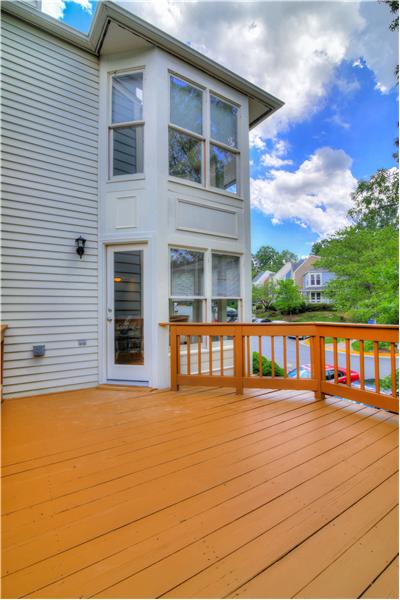 Sun-drenched deck surrounded by trees