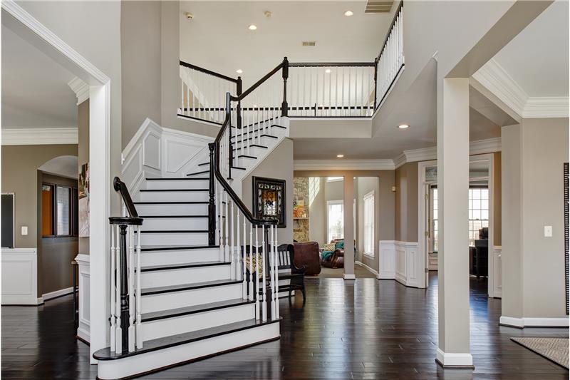 Grand 2-story entry w/exotic African Acacia hardwood floors