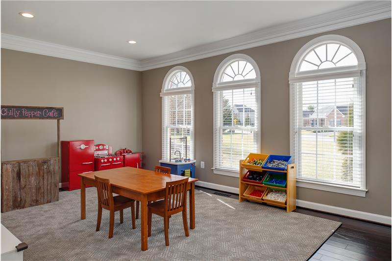 Formal living room w/recessed and paladian windows