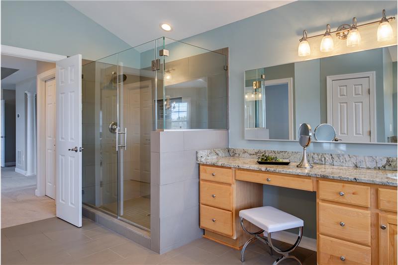 Oversized seamless shower and dual vanities