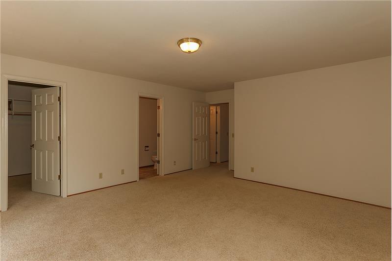 Master Bedroom with Sliding Doors to the Deck and Back Yard