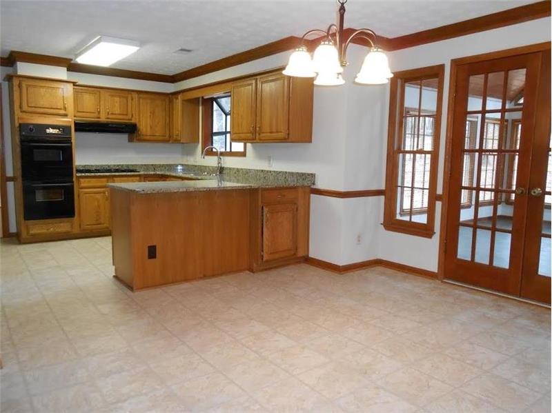 Kitchen with double ovens - French doors to sun room