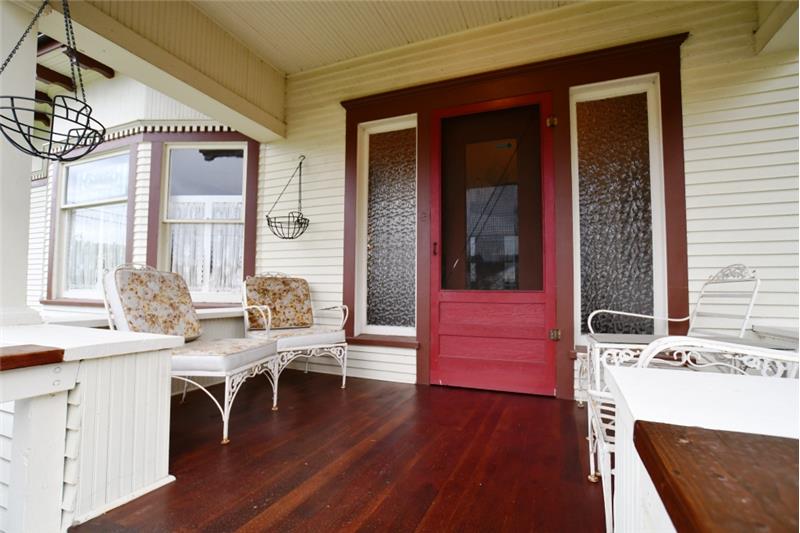 Room enough for a swing or two on this front porch. Look at those floors!!!