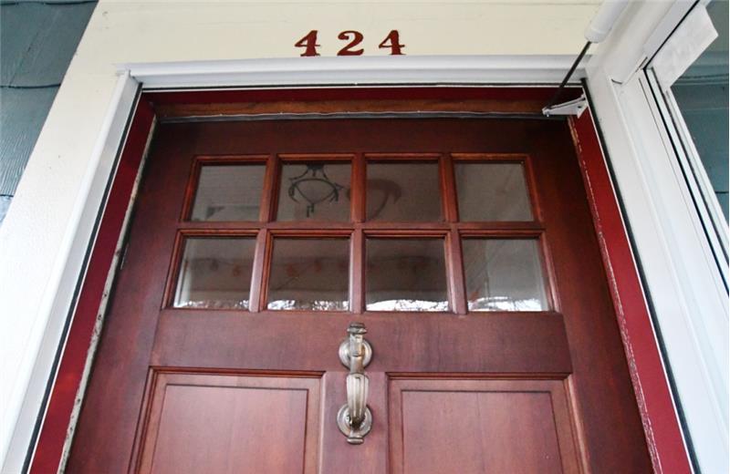 Front door - AUTHENTIC. Real solid wood, lead-glass window panes complete with door knocker!