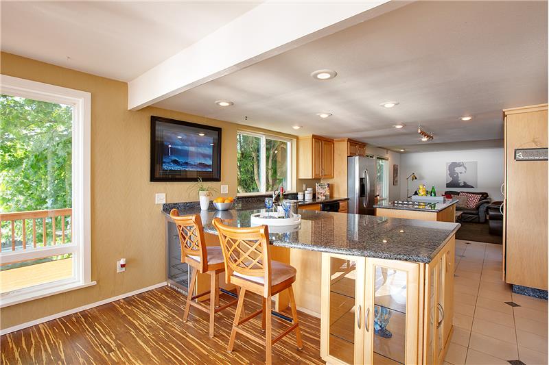 Another View of the Remodeled Light and Bright Kitchen with Eating Bar.