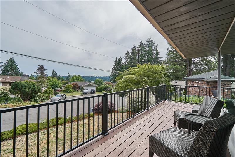 Enjoy the Partial View of Lake Ballinger from the Newer Wrap Around PVC Deck and Trex Railing.