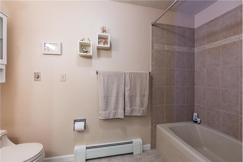 Remodeled Master Bathroom with Tile Surround Shower.