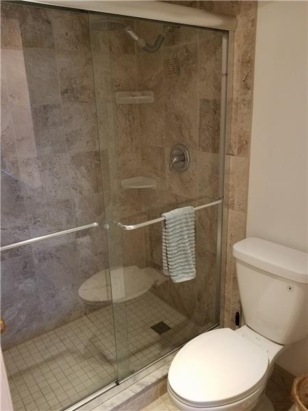 Newer earth tone tiles in Master shower