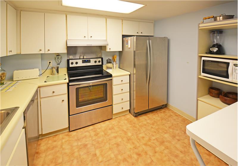Kitchen features stainless appliances
