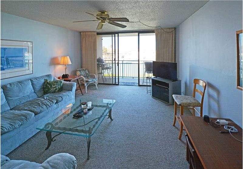 Floor to ceiling windows and door to balcony