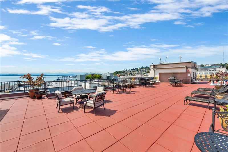 The large rooftop deck includes ample seating and BBQs for residents to enjoy.