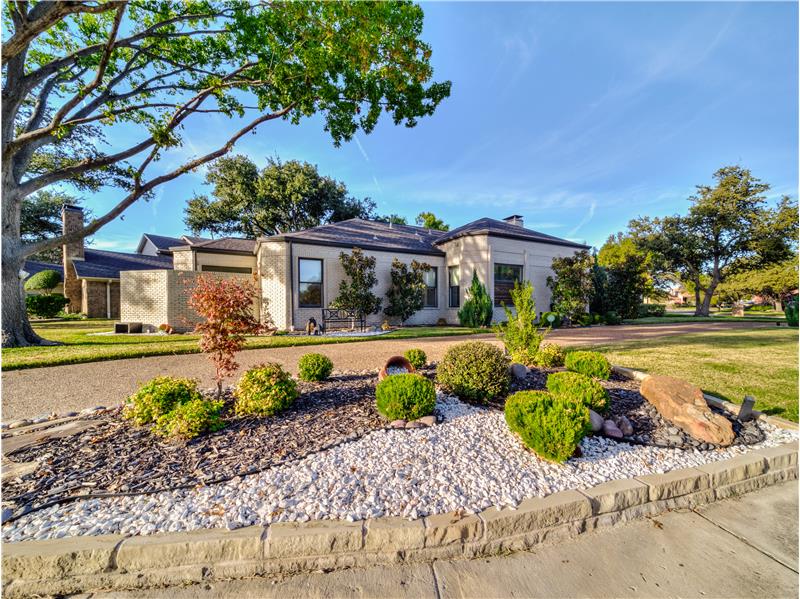 Curb Appeal Galore! Circular Driveway and pristine landscaping!