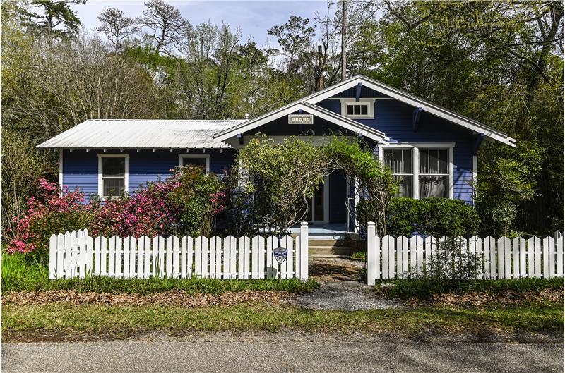 Curb appeal galore.  Exterior recently painted. Updated decorative picket fence.