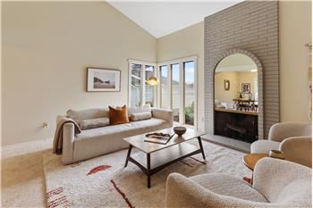 Spacious Living Room with high cathedral ceilings and a fireplace.