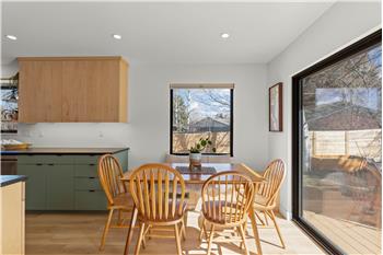 Sunny dining area next to back deck