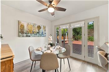 INVITING ENTERTAINING SPACE WITH VIEWS OF BACKYARD & SPACIOUS DECK!!