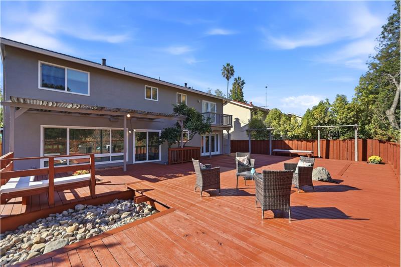 ENJOY CALIFORNIA WEATHER FROM YOUR EXPANSIVE BACKYARD DECK!!